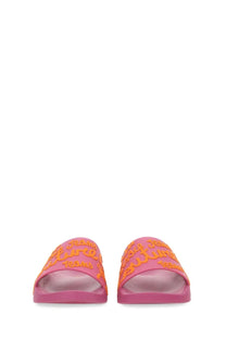Pink rubber slide sandals with orange justice lettering by Versace Jeans Couture women’s blue collection