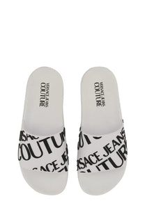 Versace jeans couture women’s white slide sandal with bold black logo print on synthetic material