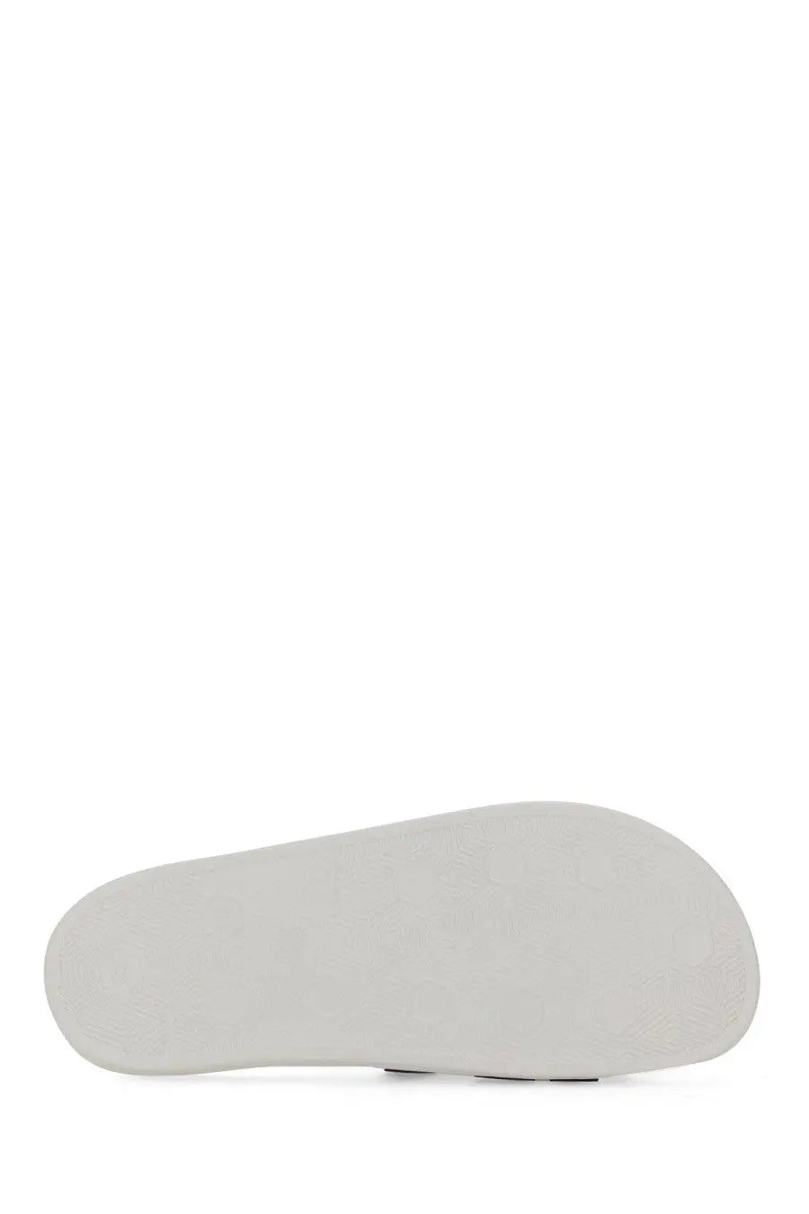White rubber sole of versace jeans couture women’s slide sandal in white showing textured grip design