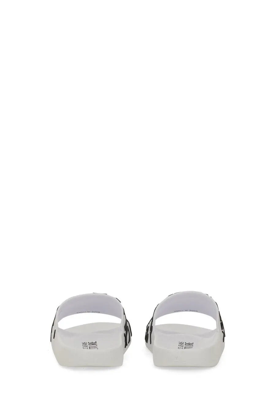 White versace jeans couture women’s slide sandal with black side stripes and minimalist design featuring branded insole