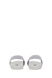 White versace jeans couture women’s slide sandal with black side stripes and minimalist design featuring branded insole
