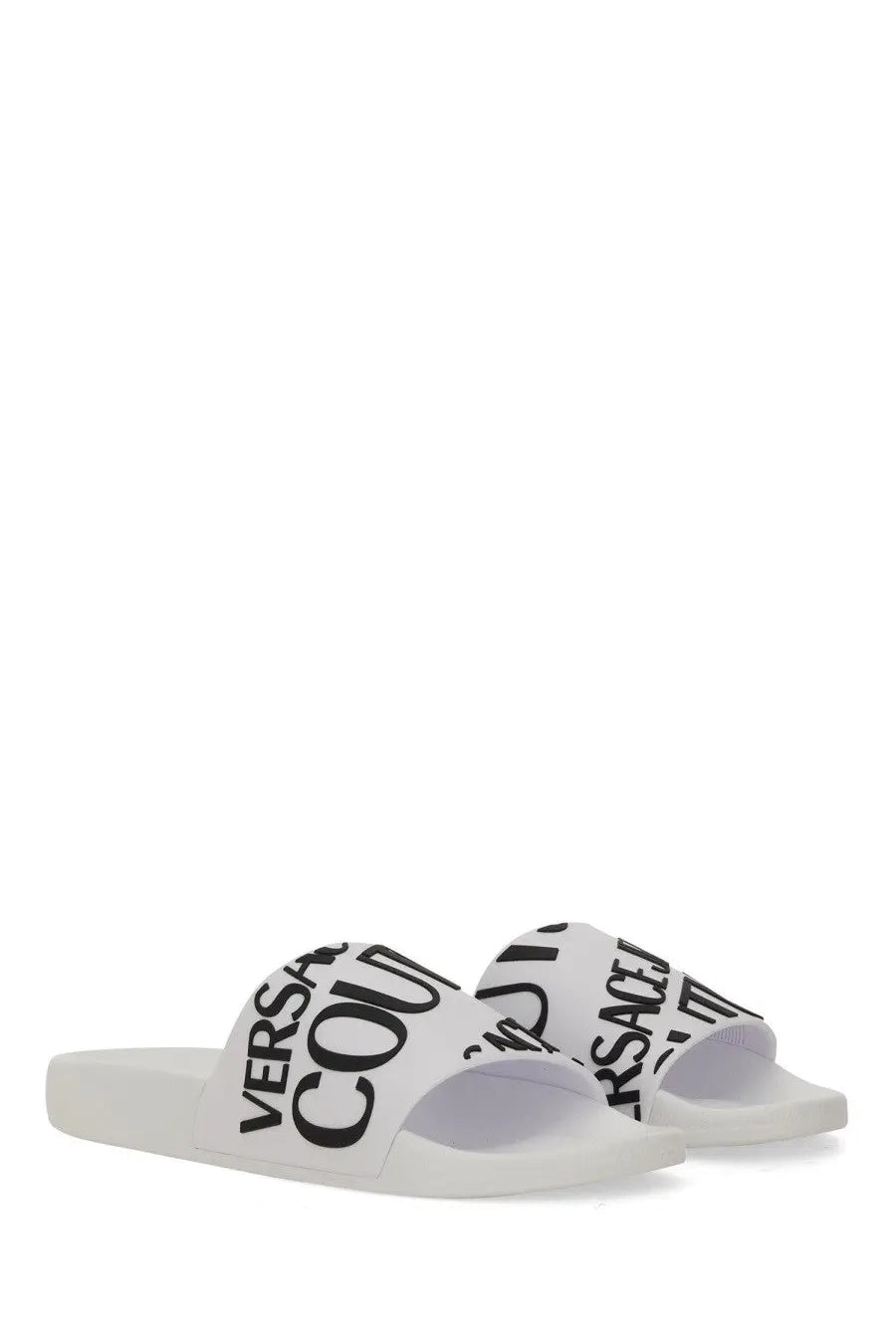 Versace Jeans Couture women’s white slide sandals with bold black versace lettering on the straps