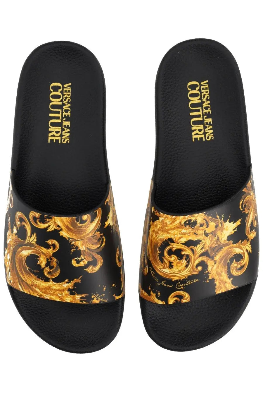 Versace Jeans Couture women’s black slides featuring a bold gold ornate baroque pattern on the footbed