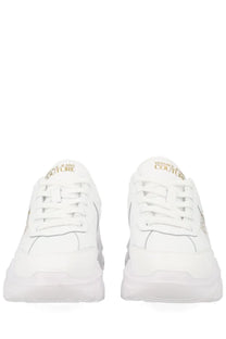 Versace Jeans Couture women’s white sneaker con with gold branding and chunky sole in leather and fabric materials