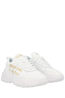 Versace Jeans Couture women’s white sneaker con with gold lettering and a chunky sole in leather and fabric