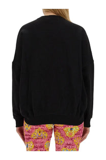Versace Jeans Couture women’s black oversized sweatshirt with ribbed cuffs and hem in cotton blend material
