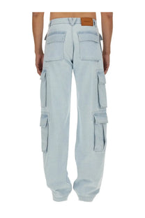 Versace men’s light-wash denim cargo jeans with multiple pockets and brown leather brand patch at the waistband