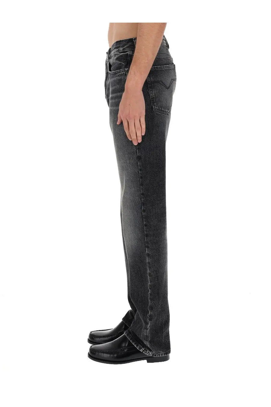 Back side of versace men’s black dark-wash denim jeans with a straight-leg cut and levi’s logo on the back pocket
