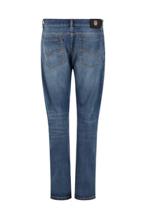 Versace men’s jeans in denim di cotone blue with classic straight-leg cut subtle fading and logo patch on waistband