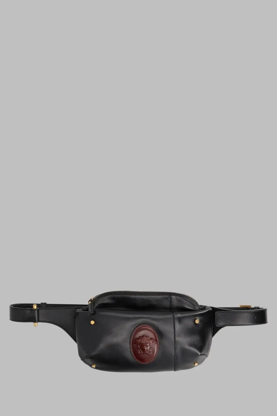 Black leather versace men’s marsupio small waist bag with a prominent brown medusa emblem on the front