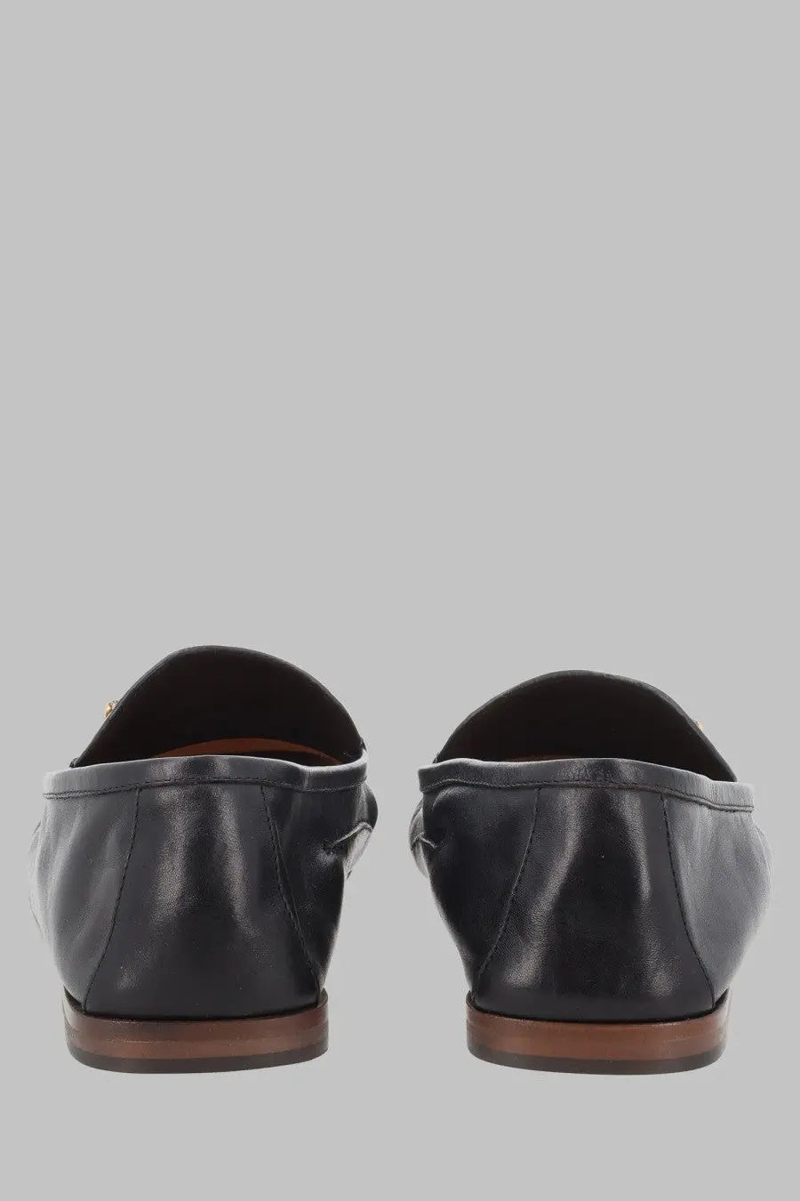 Versace men’s mocassino in pelle black leather loafers with sleek minimalist design and brown soles