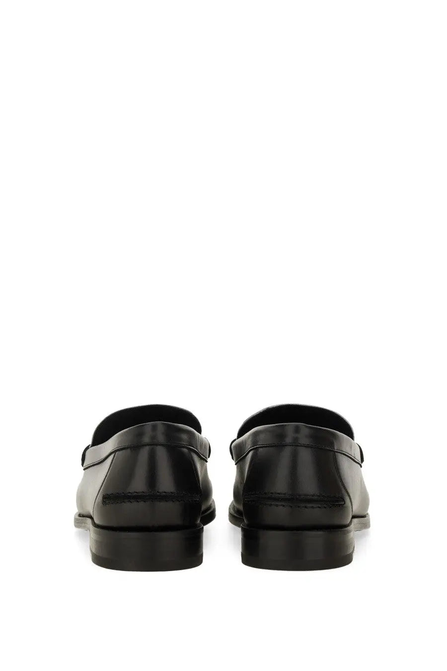Black leather loafers with a sleek polished finish and classic slip-on design in versace men’s moccasin medusa white