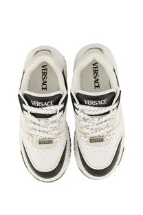 Versace men’s Odyssey sneaker black with white and black leather upper chunky sole and gold-tone Greek key detailing
