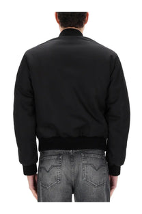 Versace men’s reversible bomber jacket in black with ribbed cuffs and waistband, front view in nylon material