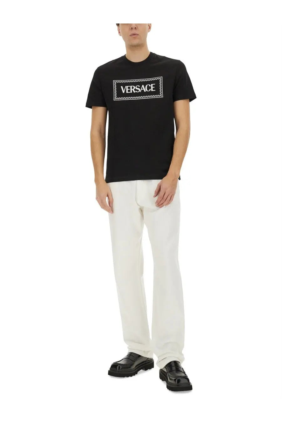 Versace men’s black t shirt featuring a white rectangular logo with the brand name in bold uppercase letters