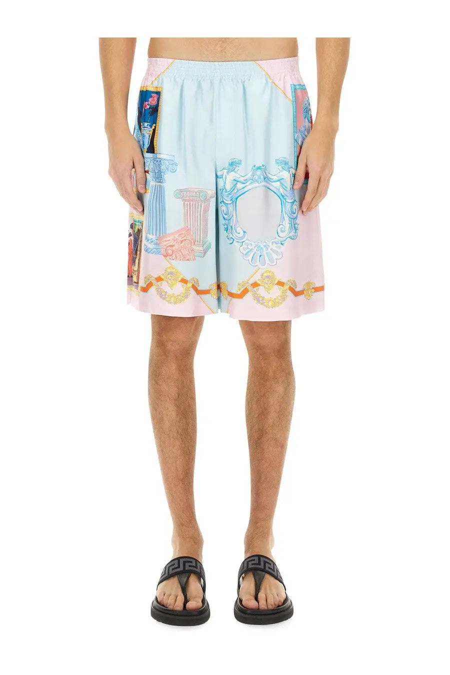 Versace men’s silk shorts in pastel pink and light blue with ornate classical motifs and gold trim