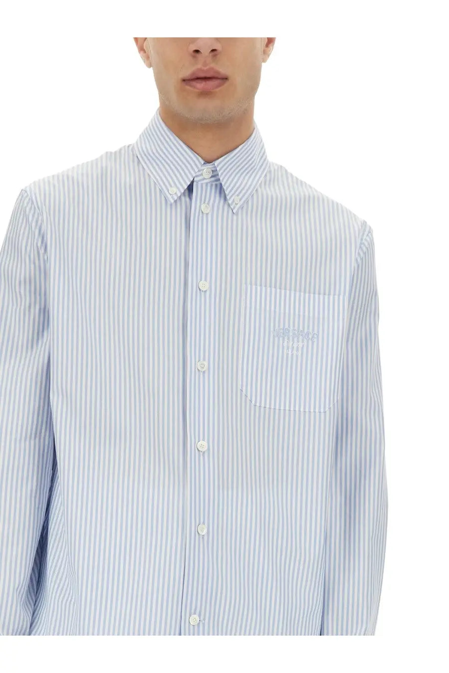 Versace men’s striped shirt in light blue and white with vertical stripes and subtle embroidered chest pocket logo