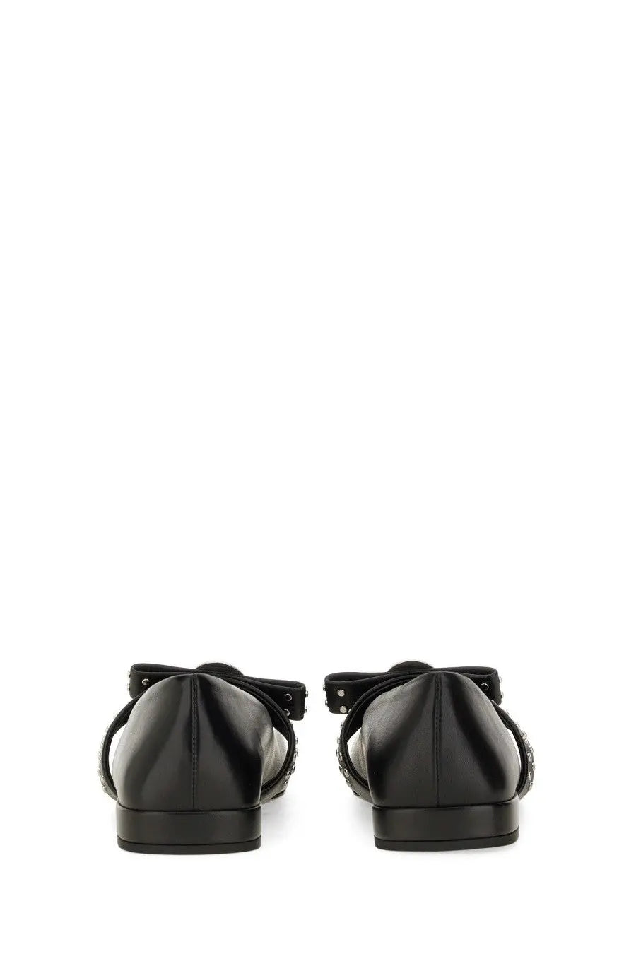 Back view of versace women’s ballerina gianni ribbon black patent leather flats with decorative bow and studded straps