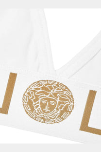 White versace women’s cotton jersey triangle bralette featuring a gold-embroidered medusa head logo and bold v lettering