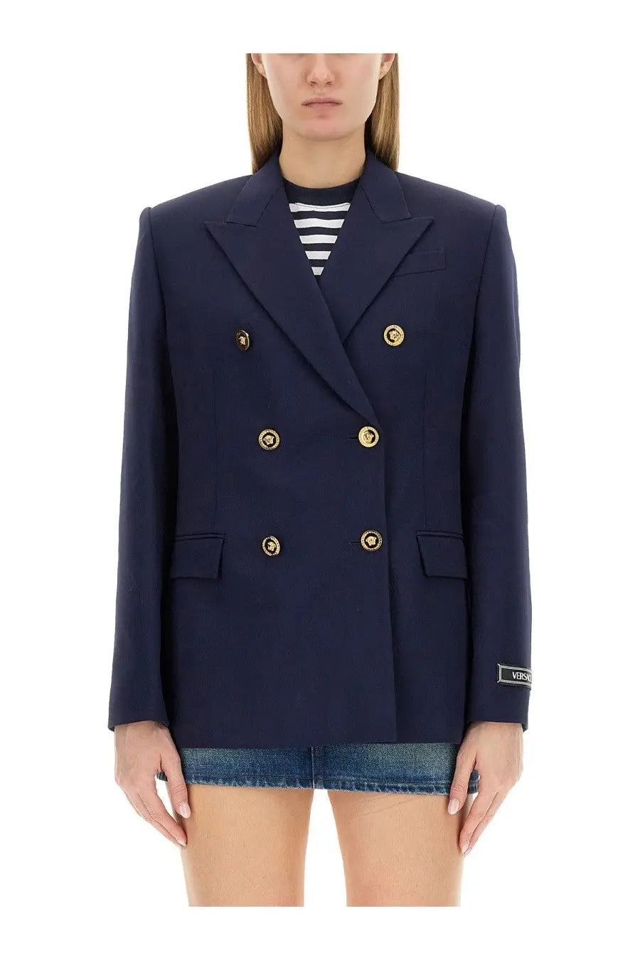 Navy blue Versace women’s double breasted blazer with gold tone Medusa head buttons and subtle brand label on cuff