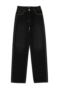 Versace women’s black denim jeans with silver studs along side seams and pockets featuring high-rise waistband