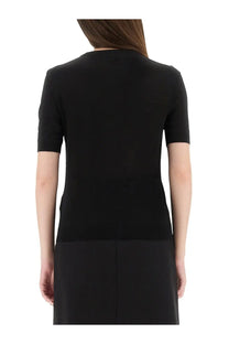 Versace women’s black knit shirt with a short-sleeved fitted silhouette made of soft knit fabric