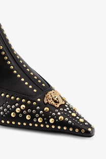 Versace women’s black leather ankle boot with gold and silver studs and golden medusa head emblem