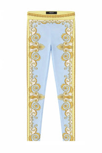 Versace women’s light blue leggings with ornate gold baroque pattern on sides and waistband for stylish wear