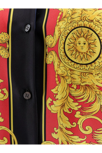 Versace women’s multicolor silk shirt featuring red and gold baroque print with black button placket
