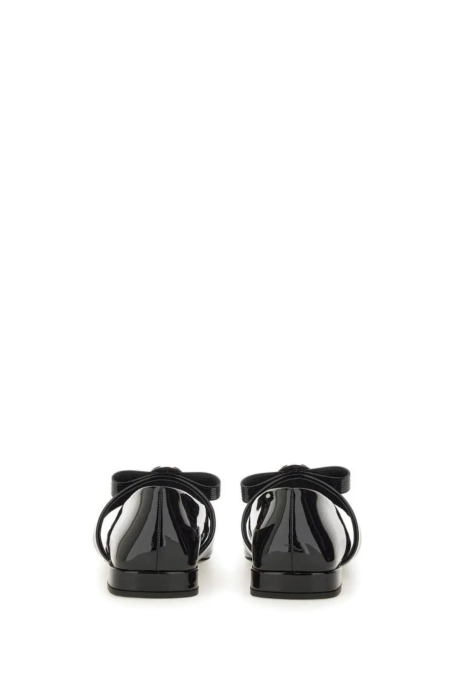 Black patent leather Versace women’s ballerina flats with glossy finish and decorative bow on the back view