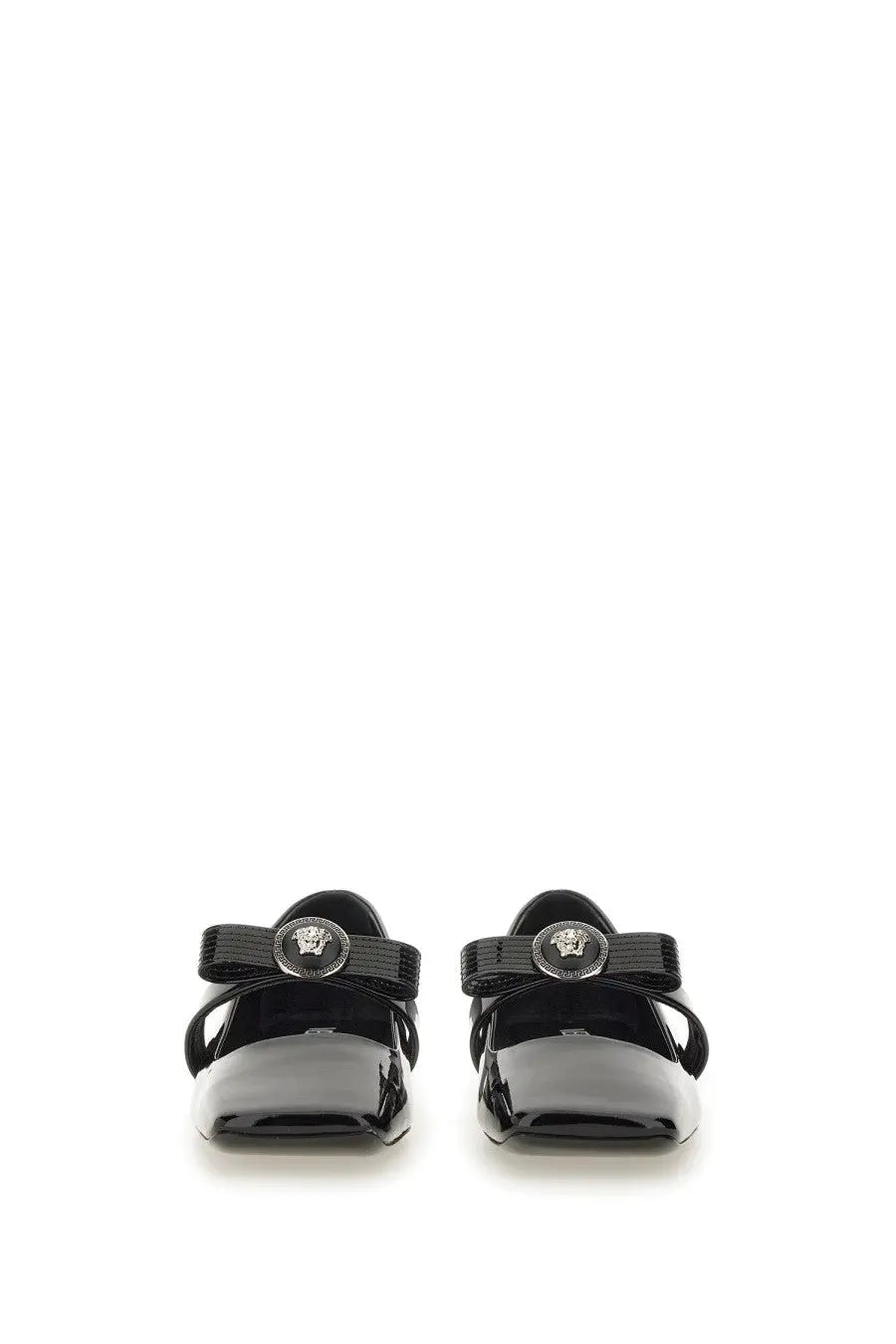Versace women’s patent leather mary jane flats in black with glossy finish and silver medusa head emblem on strap