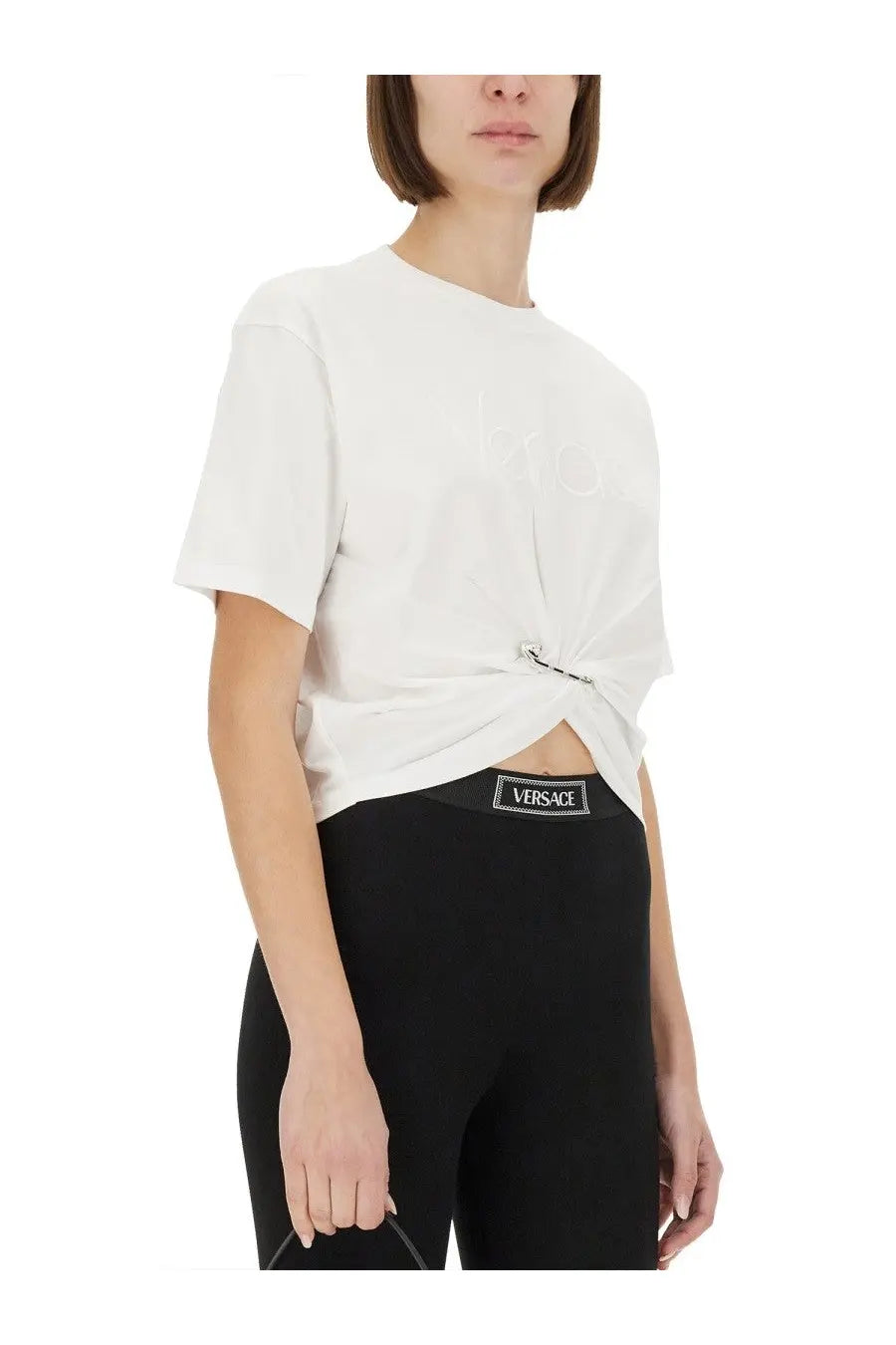 Versace women’s white short-sleeved t-shirt with subtle embossed logo and knotted front detail in cotton fabric