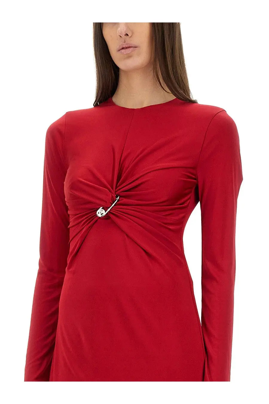 A vibrant red versace women’s midi dress with long sleeves twisted front detail and silver safety pin accent