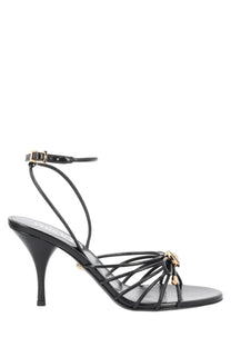 Versace women’s sandalo opera bow black leather sandal with gold-tone hardware and slender heel front view