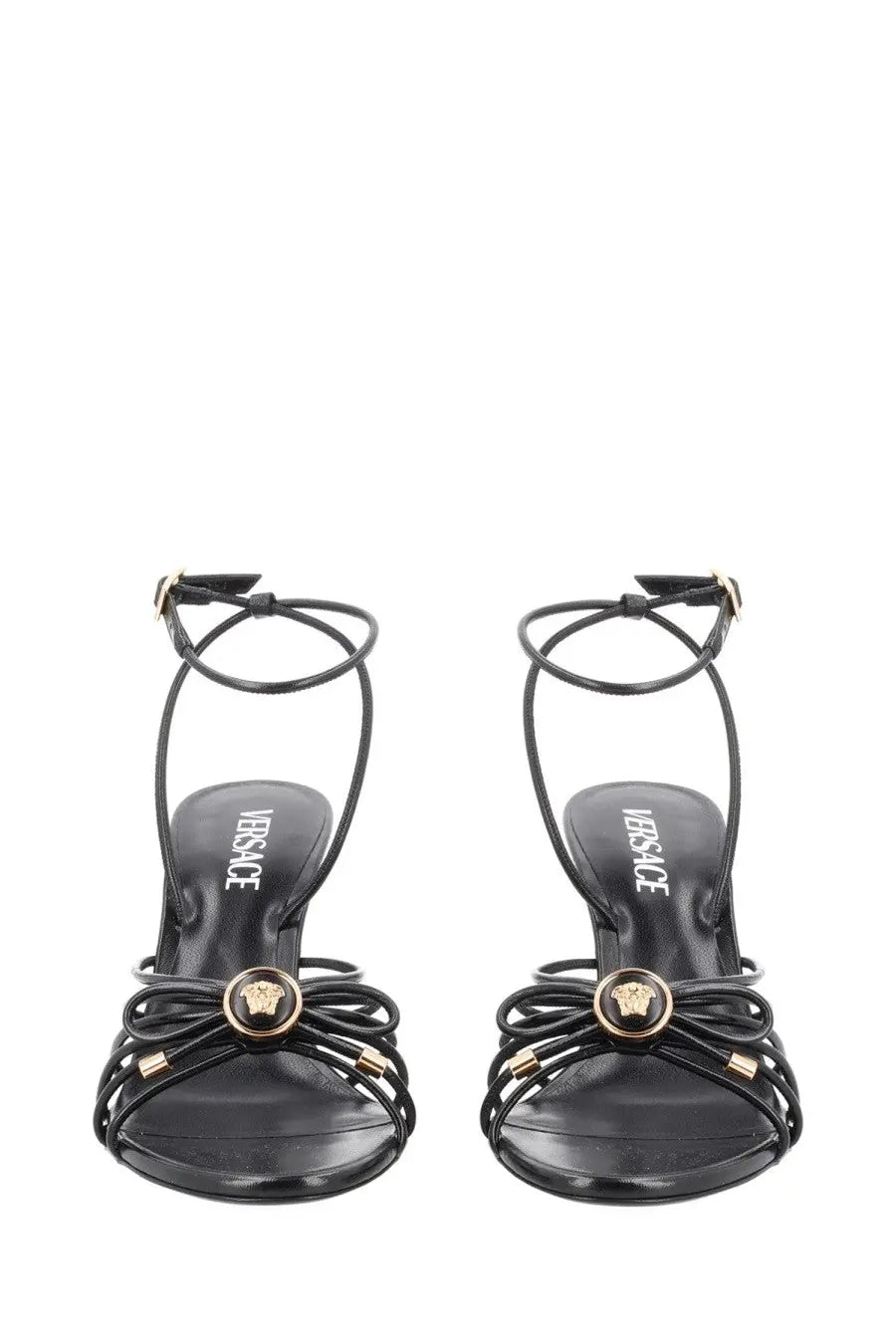 Versace women’s black leather sandalo opera bow sandals with gold-tone medusa head and crisscross straps