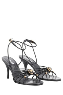 Versace women’s sandalo opera bow black leather sandals with slender straps and gold-tone medusa head embellishments