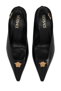 Versace women’s black patent leather slingback pumps with gold-tone medusa head embellishments at the toe