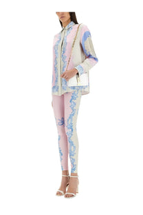 White chain-strap handbag with gold-tone clasp and minimalist design paired with versace women’s silk shirt cameo blue