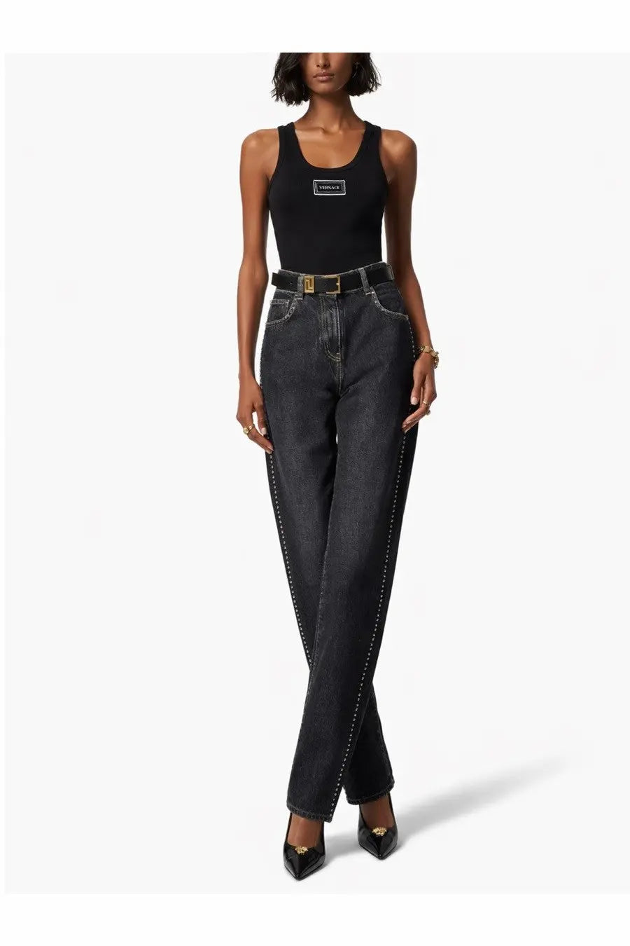 Black high-waisted jeans with gold-tone stitching and matching belt paired with versace women’s tank top black