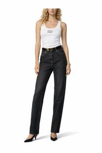 High-waisted black denim jeans with straight-leg cut and gold stitching along the sides paired with versace women’s white tank top