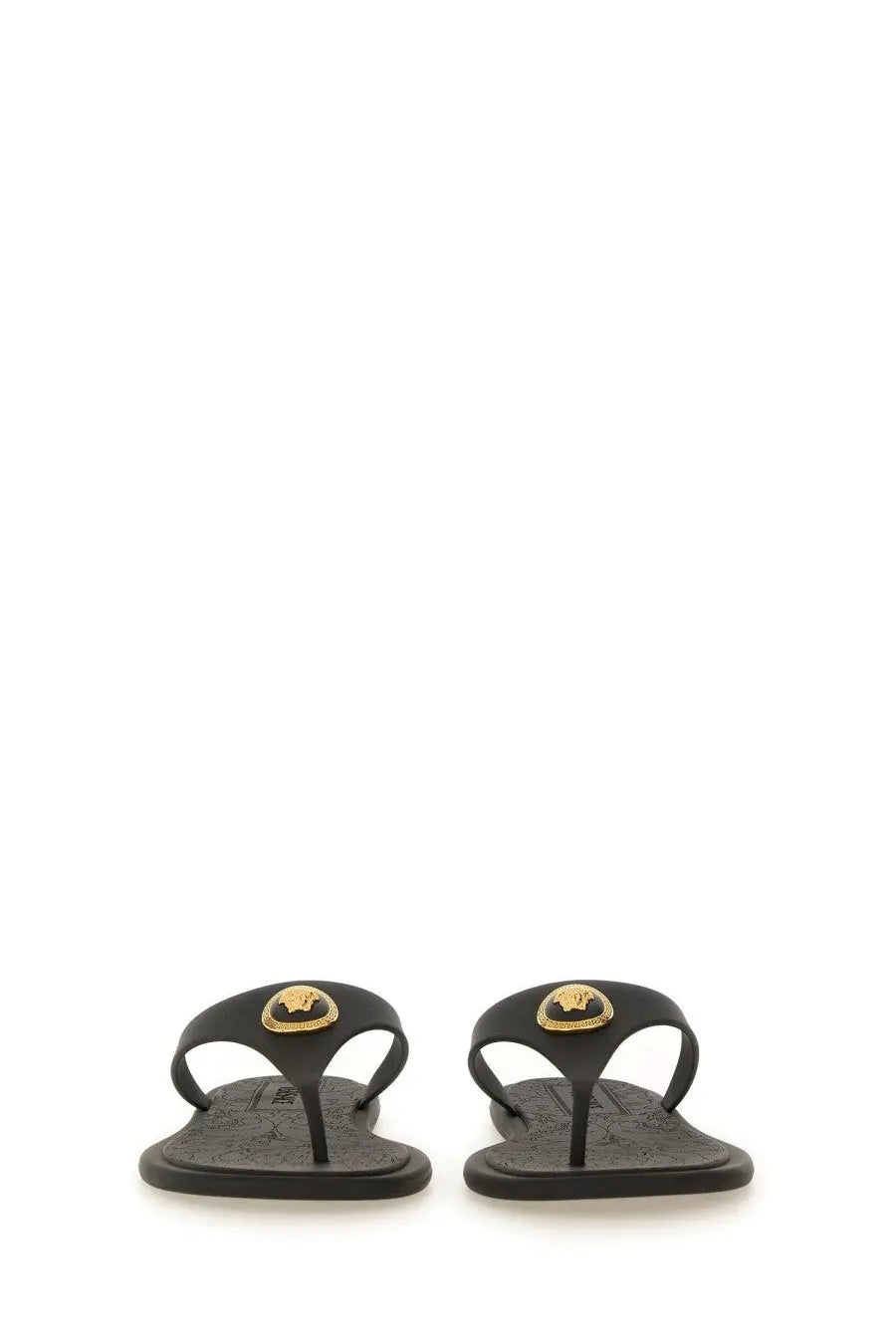 Versace women’s black leather thong sandal alia with gold-tone medusa head emblem on the toe strap