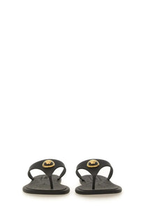 Versace women’s black leather thong sandal alia with gold-tone medusa head emblem on the toe strap