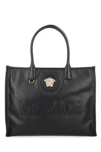 Versace womens black leather tote bag with gold-tone medusa head emblem and embossed versace lettering