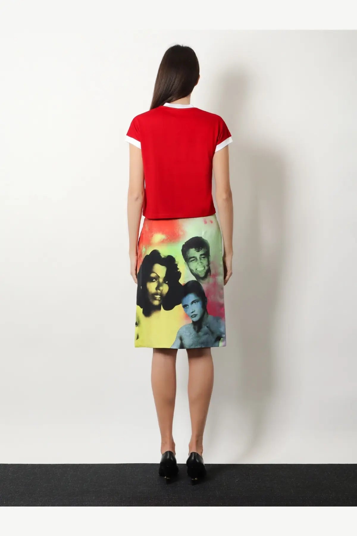 Versace women’s vintage cotton shirt in vibrant red with white trim paired with a colorful skirt featuring psychedelic portraits