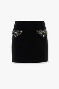 Versace women’s black virgin wool mini skirt with decorative beaded triangular appliqués on front pockets