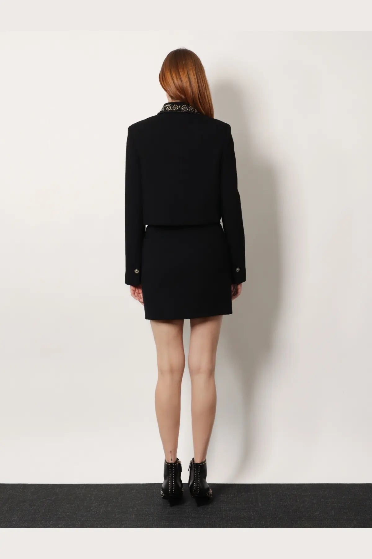 Black tailored blazer with studded collar and versace virgin wool mini skirt in black for women