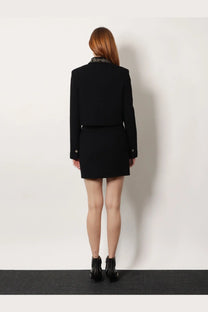 Black tailored blazer with studded collar and versace virgin wool mini skirt in black for women