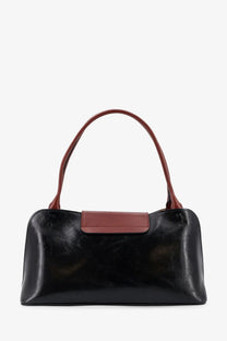 Versace women’s Vivian leather shoulder bag in black with contrasting brown handles and matching rectangular flap