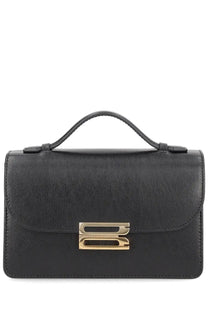 Victoria Beckham women’s black leather satchel bag with gold-tone metal clasp and top handle named Dorian Small