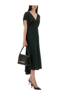 Black leather handbag with gold-tone chain detailing complementing victoria beckham green blouson midi dress